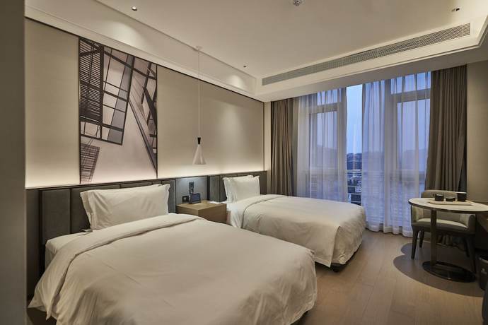 Imagen de la habitación del Hotel Qing Dao Bu Ke Bu Zhu. Foto 11