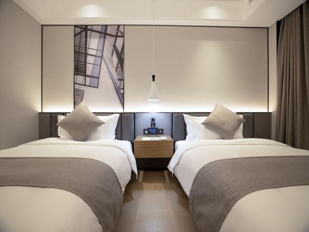 Imagen de la habitación del Hotel Qing Dao Bu Ke Bu Zhu. Foto 15