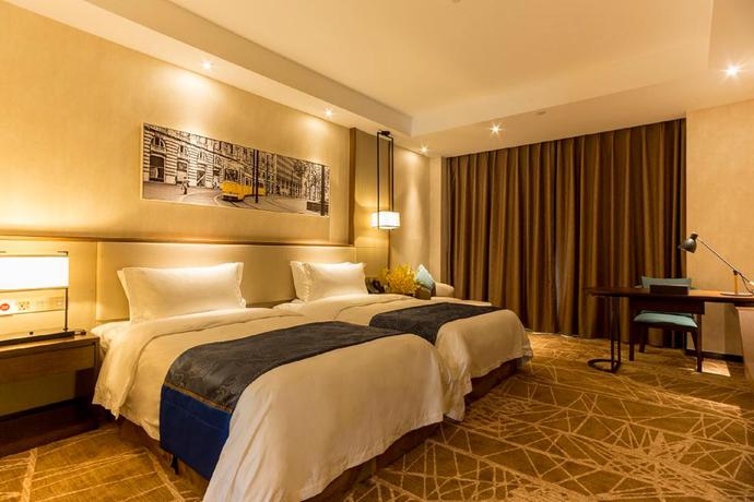 Imagen de la habitación del Hotel Qing Feng Garden Hotel. Foto 7