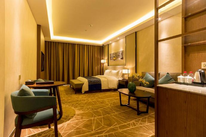 Imagen de la habitación del Hotel Qing Feng Garden Hotel. Foto 8