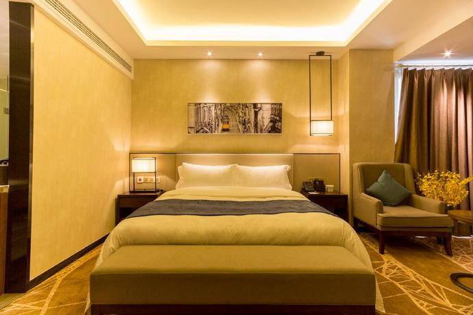 Imagen de la habitación del Hotel Qing Feng Garden Hotel. Foto 10