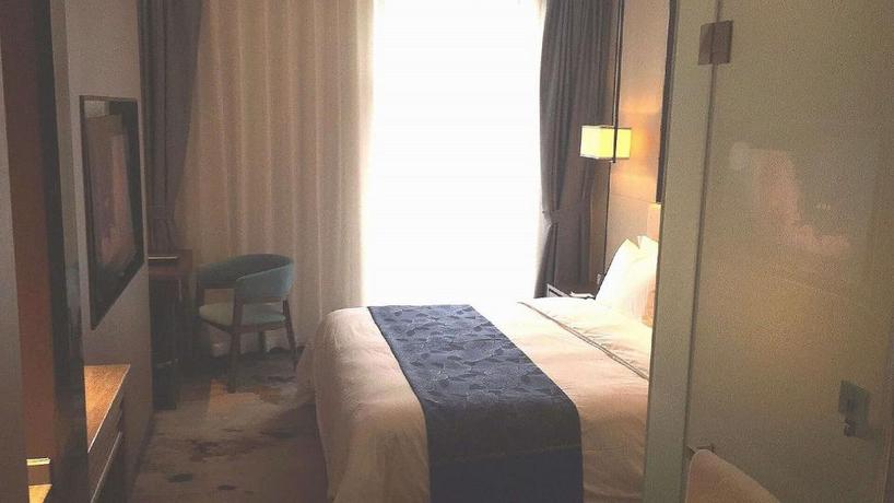 Imagen de la habitación del Hotel Qing Feng Garden Hotel. Foto 14