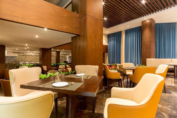 Imagen del bar/restaurante del Hotel Qing Feng Garden Hotel. Foto 4