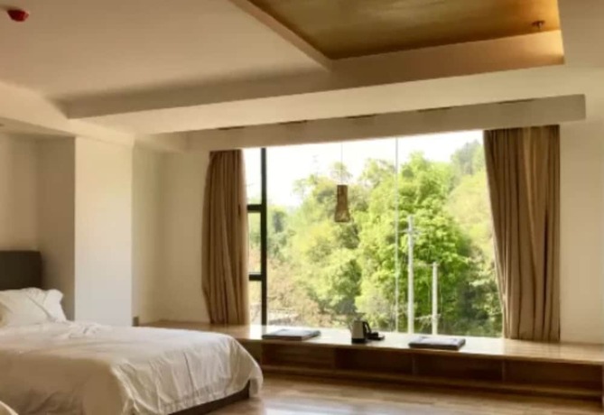 Imagen de la habitación del Hotel Qing Gu Ju. Foto 7