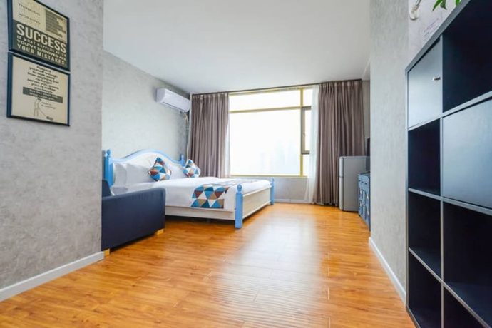 Imagen de la habitación del Hotel Qing Ya Apartment Chongqing. Foto 3