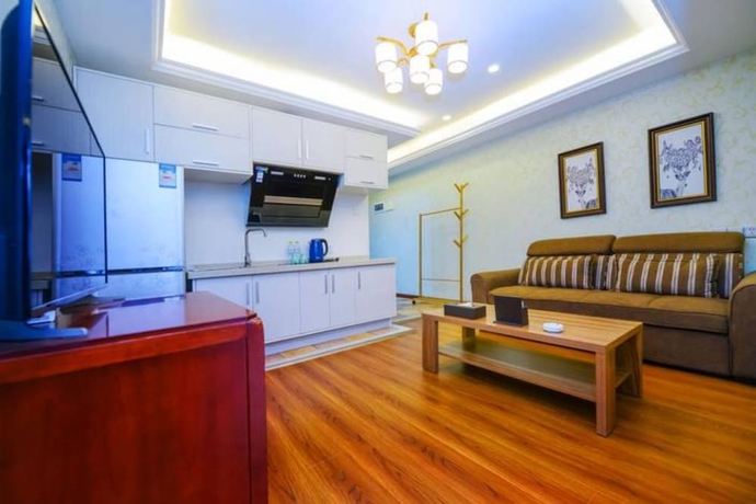 Imagen de la habitación del Hotel Qing Ya Apartment Chongqing. Foto 9