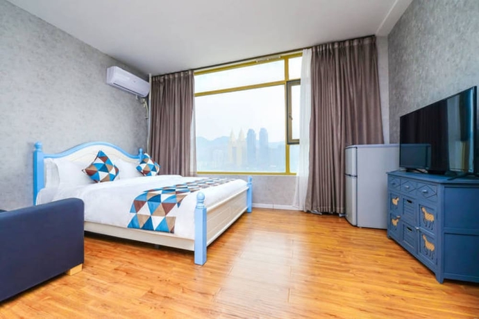 Imagen de la habitación del Hotel Qing Ya Apartment Chongqing. Foto 11