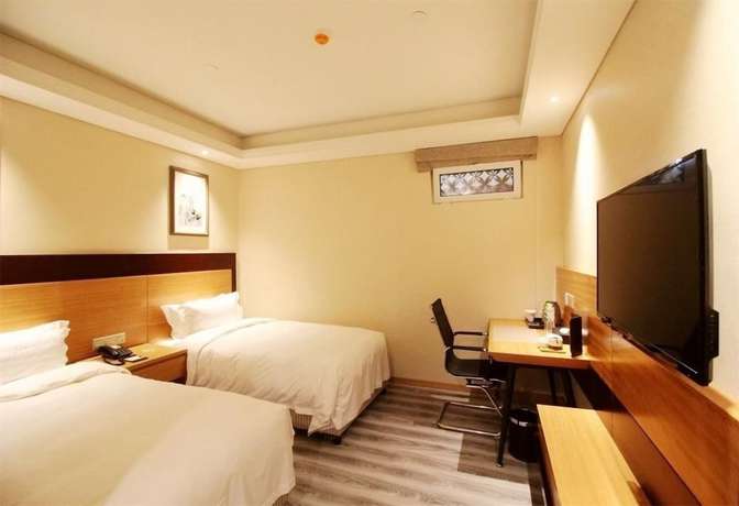 Imagen de la habitación del Hotel Qingdao Airport Fuhua. Foto 15