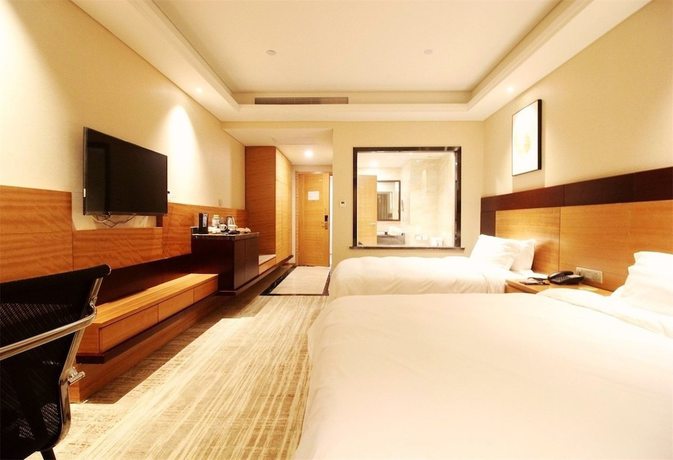 Imagen de la habitación del Hotel Qingdao Airport Fuhua. Foto 17