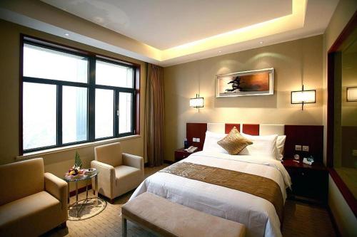 Imagen de la habitación del Hotel Qingdao Blue Horizon. Foto 8
