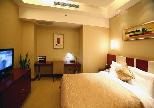 Imagen de la habitación del Hotel Qingdao Blue Horizon. Foto 10