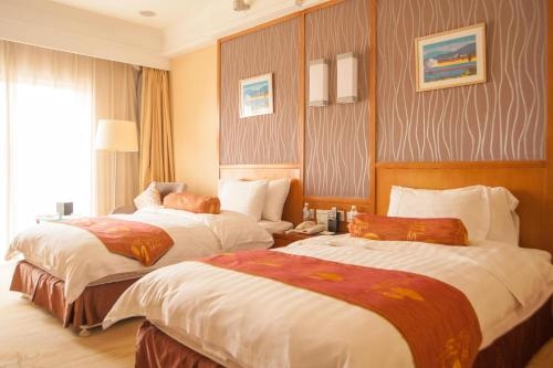 Imagen de la habitación del Hotel Qingdao Blue Horizon Huangdao, Qingdao. Foto 7