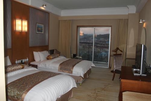 Imagen de la habitación del Hotel Qingdao Blue Horizon Huangdao, Qingdao. Foto 8