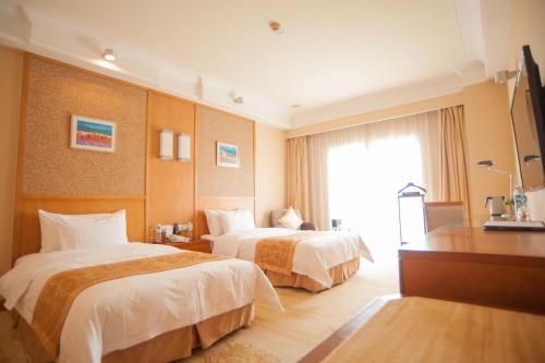 Imagen de la habitación del Hotel Qingdao Blue Horizon Huangdao, Qingdao. Foto 9