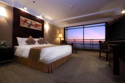 Imagen de la habitación del Hotel Qingdao Blue Horizon - Laoshan. Foto 7