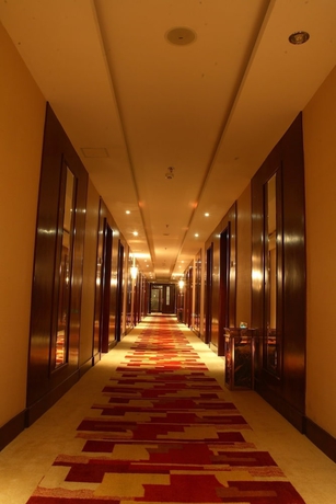 Imagen de los interiores del Hotel Qingdao Chengyang Qiulin. Foto 12
