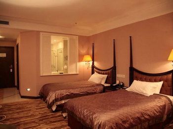 Imagen de la habitación del Hotel Qingdao Danube International. Foto 5