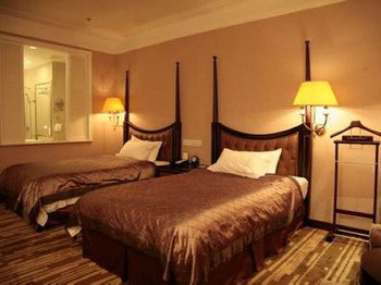 Imagen de la habitación del Hotel Qingdao Danube International. Foto 11