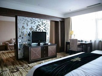 Imagen de la habitación del Hotel Qingdao Danube International. Foto 13