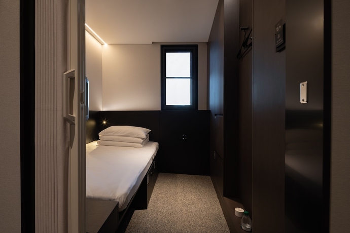 Imagen de la habitación del Hotel Qingdao Desti Youth Park Hostel - Qingdao May Fourth Square. Foto 2