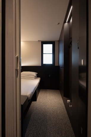 Imagen de la habitación del Hotel Qingdao Desti Youth Park Hostel - Qingdao May Fourth Square. Foto 3
