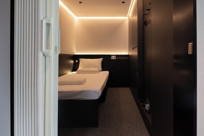 Imagen de la habitación del Hotel Qingdao Desti Youth Park Hostel - Qingdao May Fourth Square. Foto 4