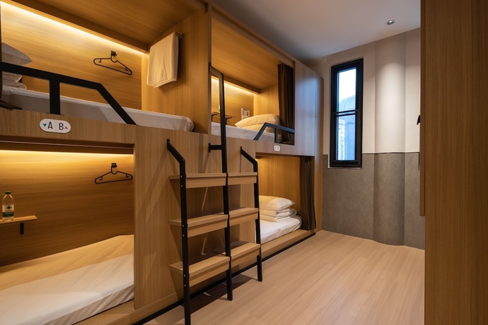Imagen de la habitación del Hotel Qingdao Desti Youth Park Hostel - Qingdao May Fourth Square. Foto 9