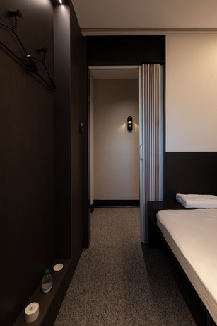 Imagen de la habitación del Hotel Qingdao Desti Youth Park Hostel - Qingdao May Fourth Square. Foto 15