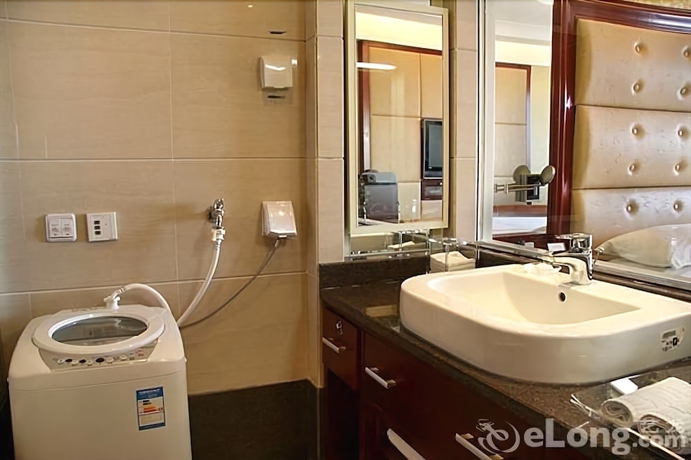 Imagen de la habitación del Hotel Qingdao Fuxin Hotel. Foto 4