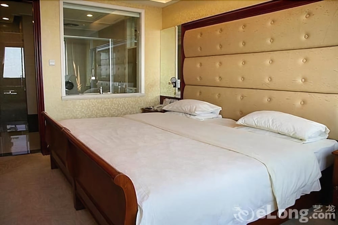 Imagen de la habitación del Hotel Qingdao Fuxin Hotel. Foto 5