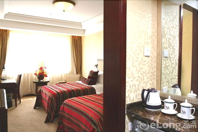Imagen de la habitación del Hotel Qingdao Fuxin Hotel. Foto 7