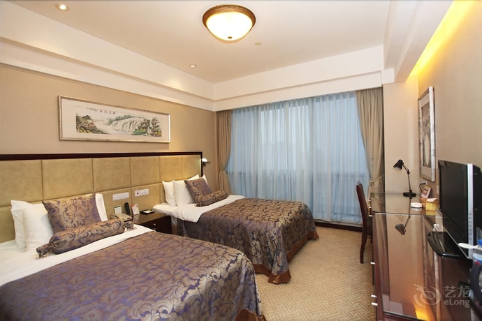 Imagen de la habitación del Hotel Qingdao Fuxin Hotel. Foto 9