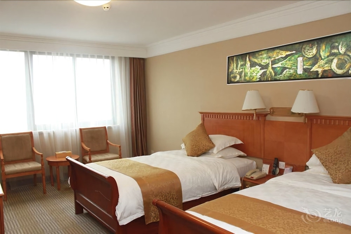 Imagen de la habitación del Hotel Qingdao Fuxin Hotel. Foto 10