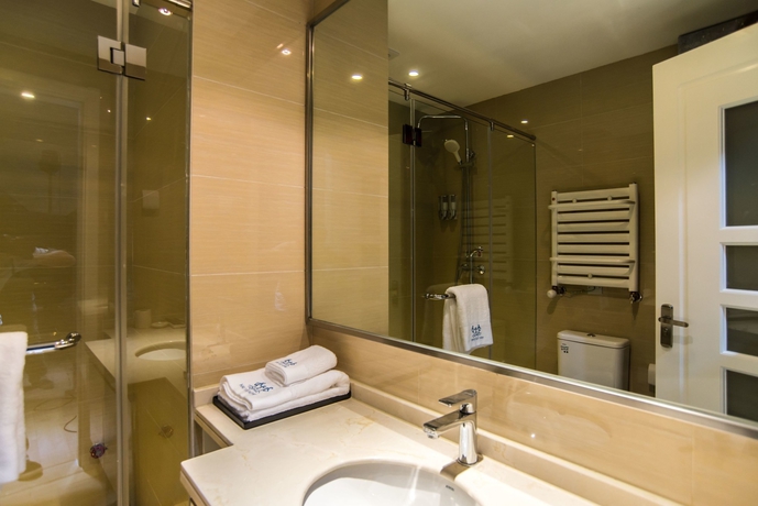 Imagen de la habitación del Hotel Qingdao Haiyue Home Resort. Foto 4