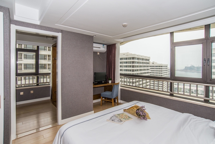 Imagen de la habitación del Hotel Qingdao Haiyue Home Resort. Foto 5
