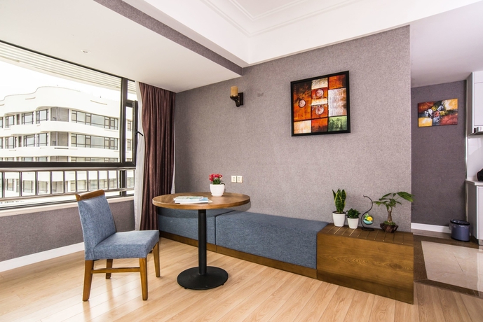 Imagen de la habitación del Hotel Qingdao Haiyue Home Resort. Foto 10