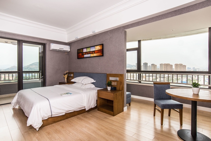 Imagen de la habitación del Hotel Qingdao Haiyue Home Resort. Foto 13