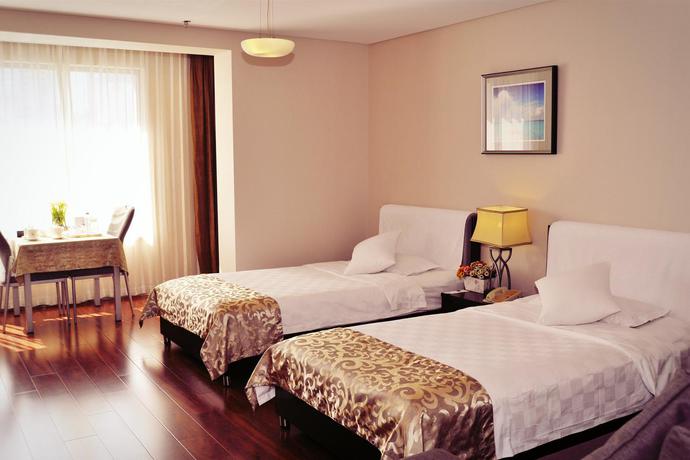 Imagen general del Hotel Qingdao Housing International. Foto 1