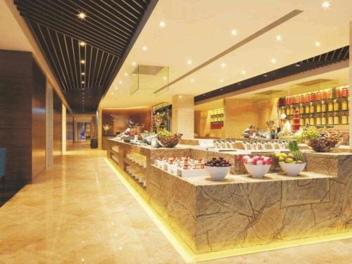 Imagen general del Hotel Qingdao Huaxi Laixi. Foto 9