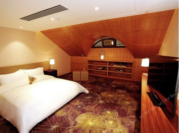 Imagen de la habitación del Hotel Qingdao Impression Hotel. Foto 7