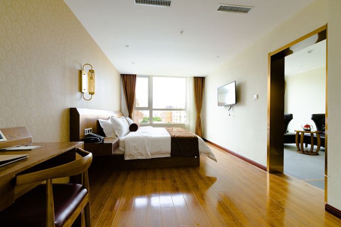 Imagen de la habitación del Hotel Qingdao James Joyce. Foto 2