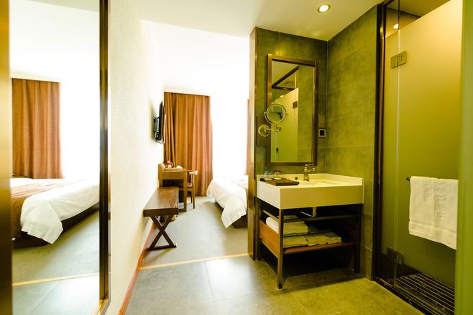 Imagen de la habitación del Hotel Qingdao James Joyce. Foto 3
