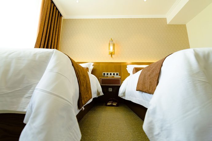 Imagen de la habitación del Hotel Qingdao James Joyce. Foto 4