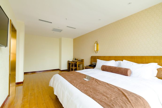 Imagen de la habitación del Hotel Qingdao James Joyce. Foto 6