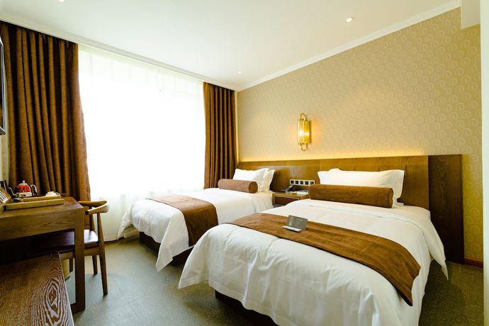 Imagen de la habitación del Hotel Qingdao James Joyce. Foto 7