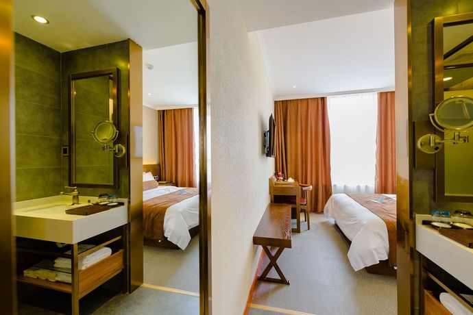 Imagen de la habitación del Hotel Qingdao James Joyce. Foto 8