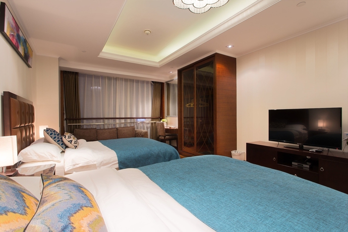 Imagen de la habitación del Hotel Qingdao Jinshan We Holiday Apt Wusi. Foto 4
