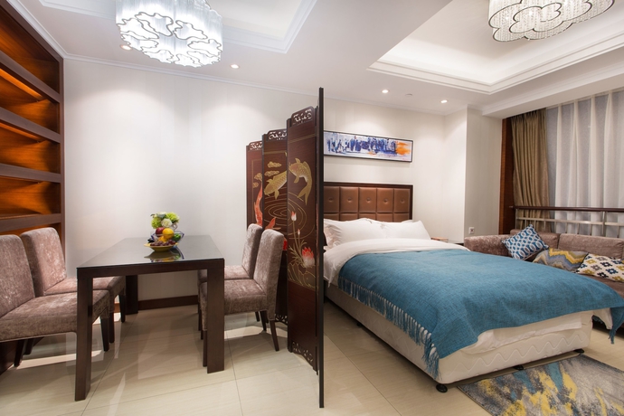 Imagen de la habitación del Hotel Qingdao Jinshan We Holiday Apt Wusi. Foto 6