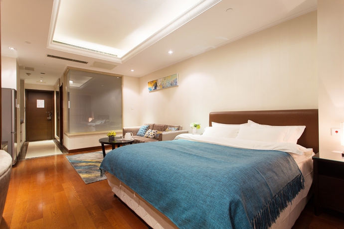 Imagen de la habitación del Hotel Qingdao Jinshan We Holiday Apt Wusi. Foto 10