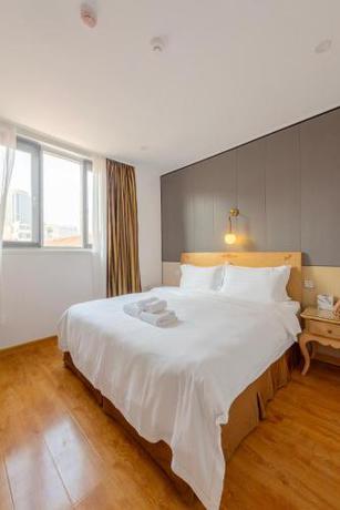 Imagen de la habitación del Hotel Qingdao Liuying Jieli - Qingdao Station Trestle Bridge Branch. Foto 13